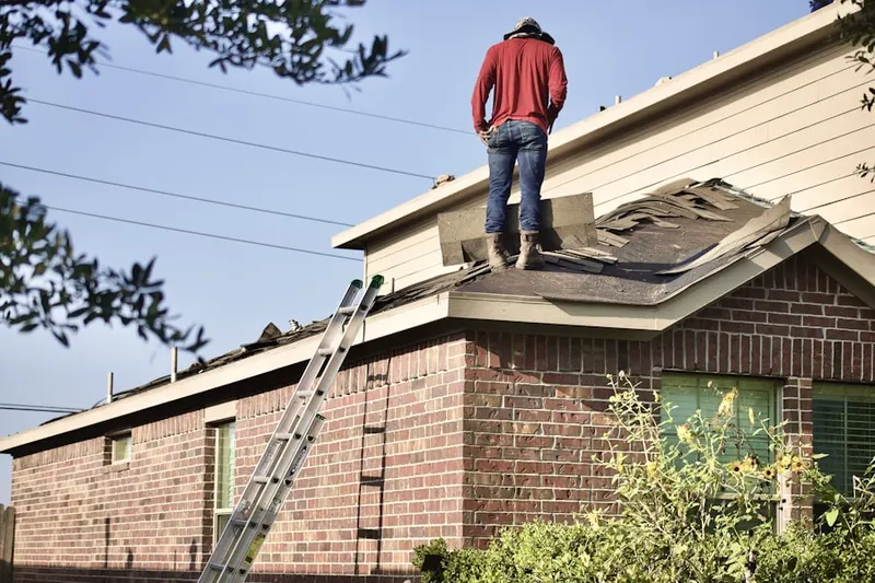Professional roofer working on a residential roof in Rancho Park